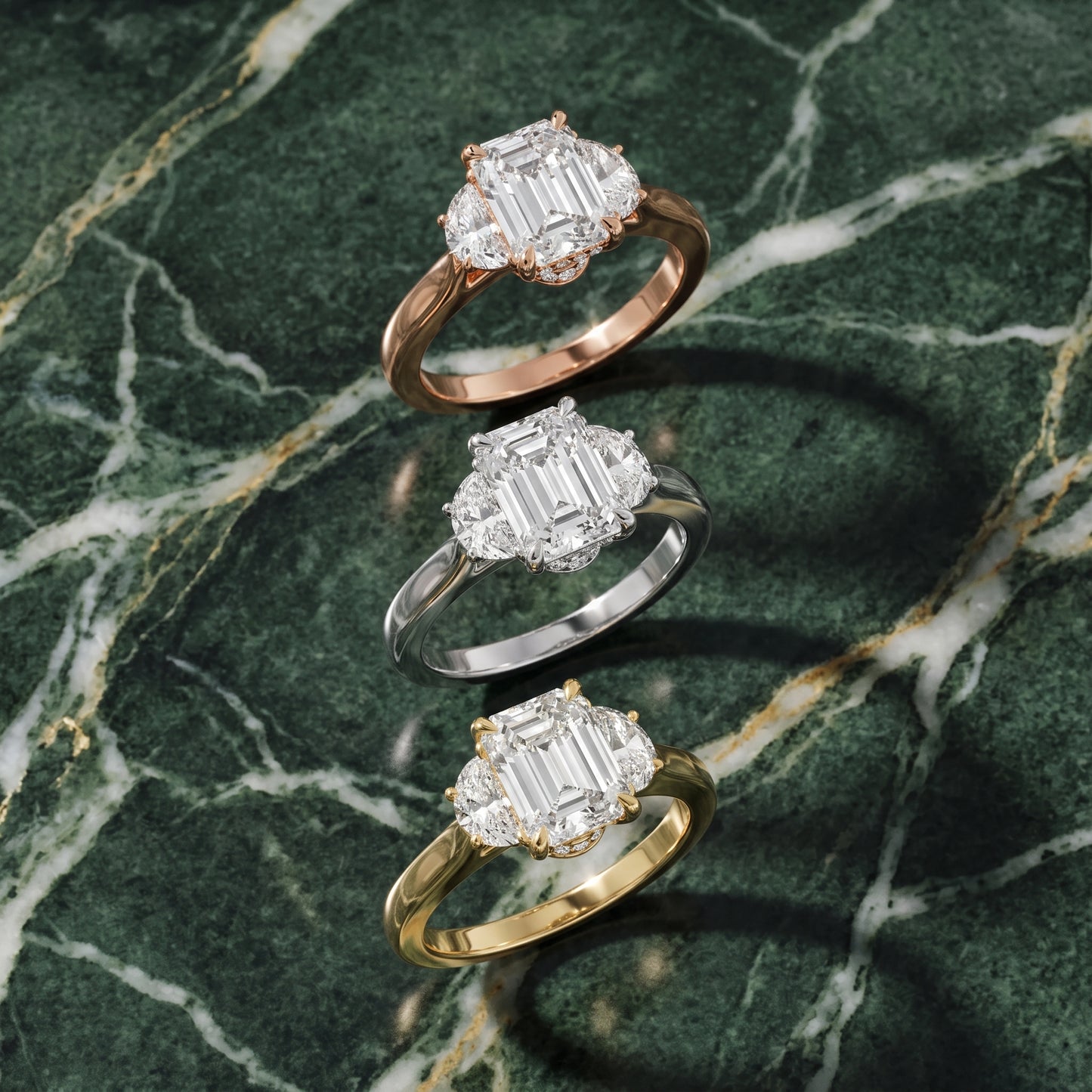 Romy Three-Stone Emerald Diamond Engagement Ring in Yellow Gold - 3rings.jpg