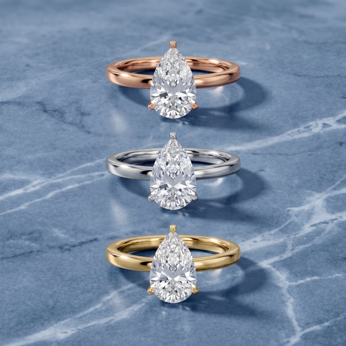 Liana Solitaire Claw Prong Pear Diamond Engagement Ring in Silver - 3rings.jpg