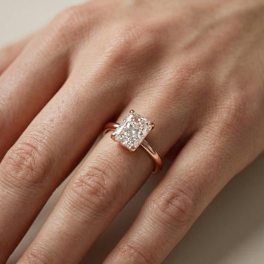 Charlotte Charm Radiant Cut Lab Grown Diamond Solitaire Engagement Ring in Rose Gold showing side profile and hidden halo.