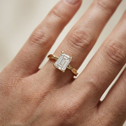 Emerald Cut Lab Grown Diamond Engagement Ring with Twisted Shank in Yellow Gold