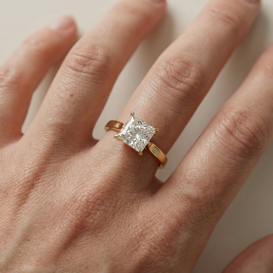 Princess Cut Lab Grown Diamond Solitaire Engagement Ring in Yellow Gold floral setting.
