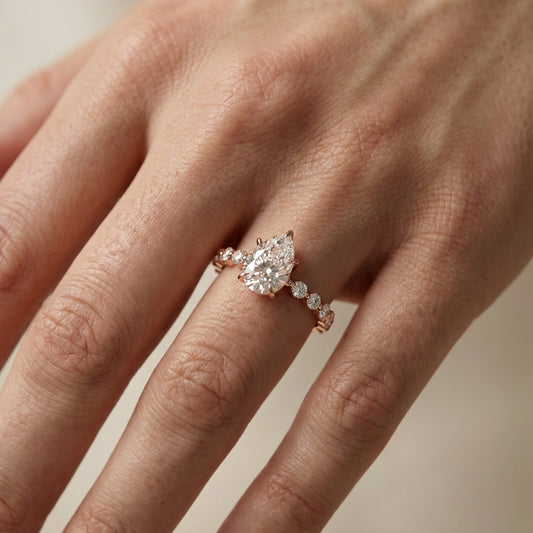 Pear Cut Lab Grown Diamond Engagement Ring with floating side stones in Rose Gold