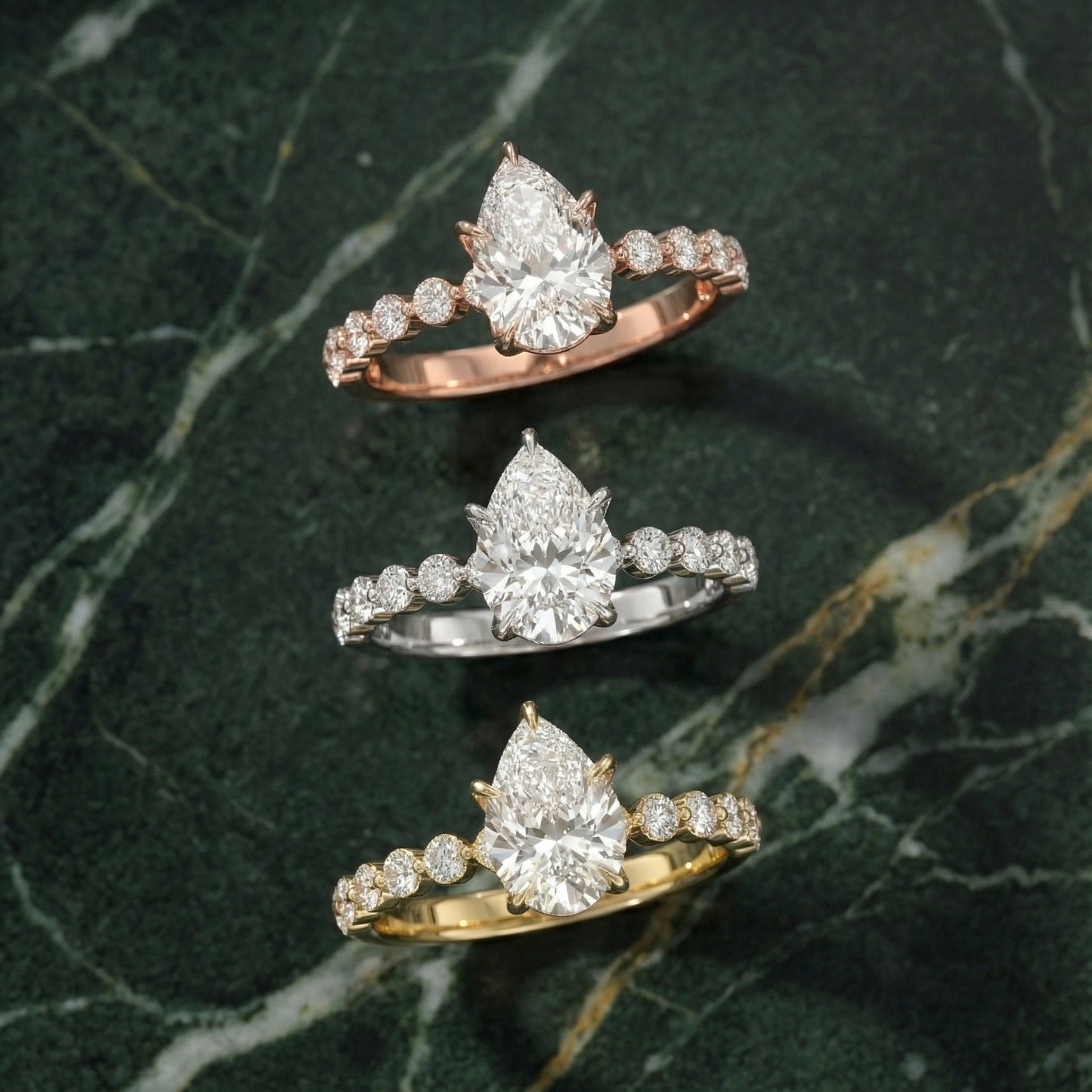 Pear Cut Lab Grown Diamond Engagement Ring with floating side stones in Yellow Gold