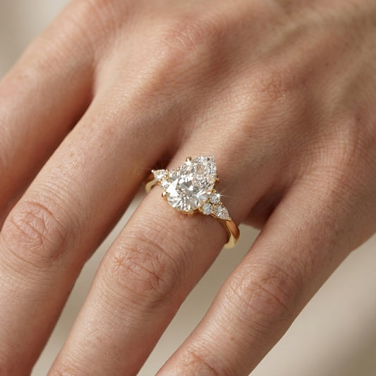 Pear Cut Lab Grown Diamond Three Stone Engagement Ring in Yellow Gold