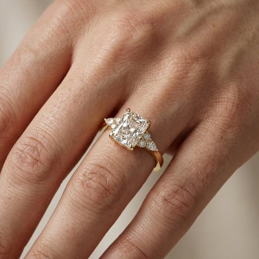 Radiant Cut Lab Grown Diamond Three Stone Engagement Ring in Yellow Gold