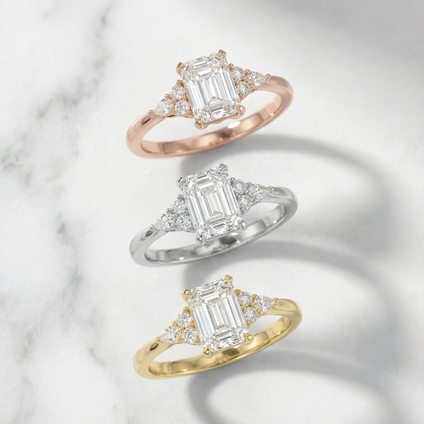 Emerald Cut Lab Grown Diamond Engagement Ring with side stone clusters set in Yellow Gold