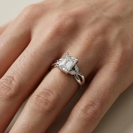Emerald Cut Lab Grown Diamond Twisted Engagement Ring in White Gold with Marquise Side Stones