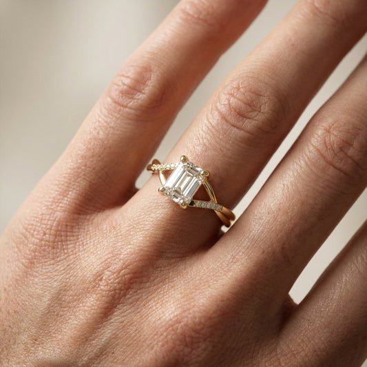 Emerald Cut Lab Grown Diamond Side Stone Engagement Ring in Yellow Gold