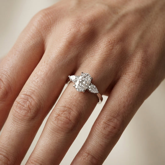 Oval Cut Lab Grown Diamond Three Stone Engagement Ring in Platinum