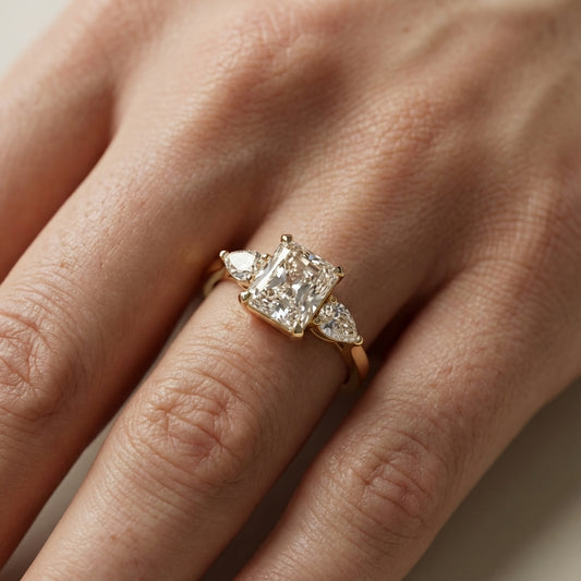 Radiant Cut Lab Grown Diamond Three Stone Engagement Ring in Yellow Gold