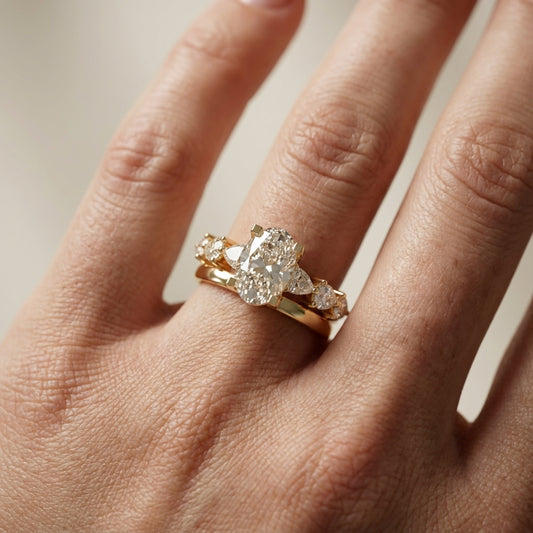 Oval Cut Lab Grown Diamond Engagement Ring with Marquise and Pear Side Stones in Yellow Gold
