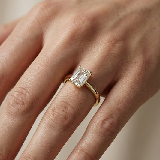 Emerald Cut Lab Grown Diamond Solitaire Engagement Ring in Yellow Gold showing secret under-gallery