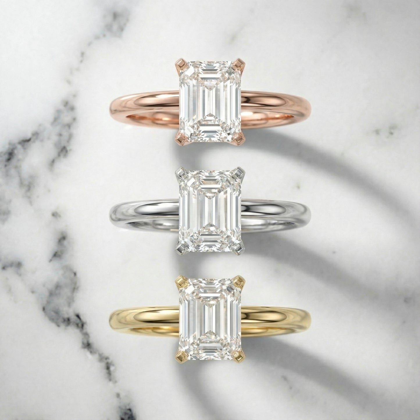 Emerald Cut Lab Grown Diamond Solitaire Engagement Ring in Yellow Gold showing cathedral setting