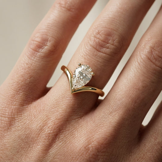 Pear Cut Lab Grown Diamond Chevron Solitaire Engagement Ring in Yellow Gold