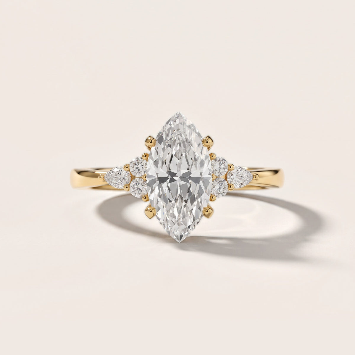 Amelia Three Stone Marquise Diamond Engagement Ring in Yellow Gold