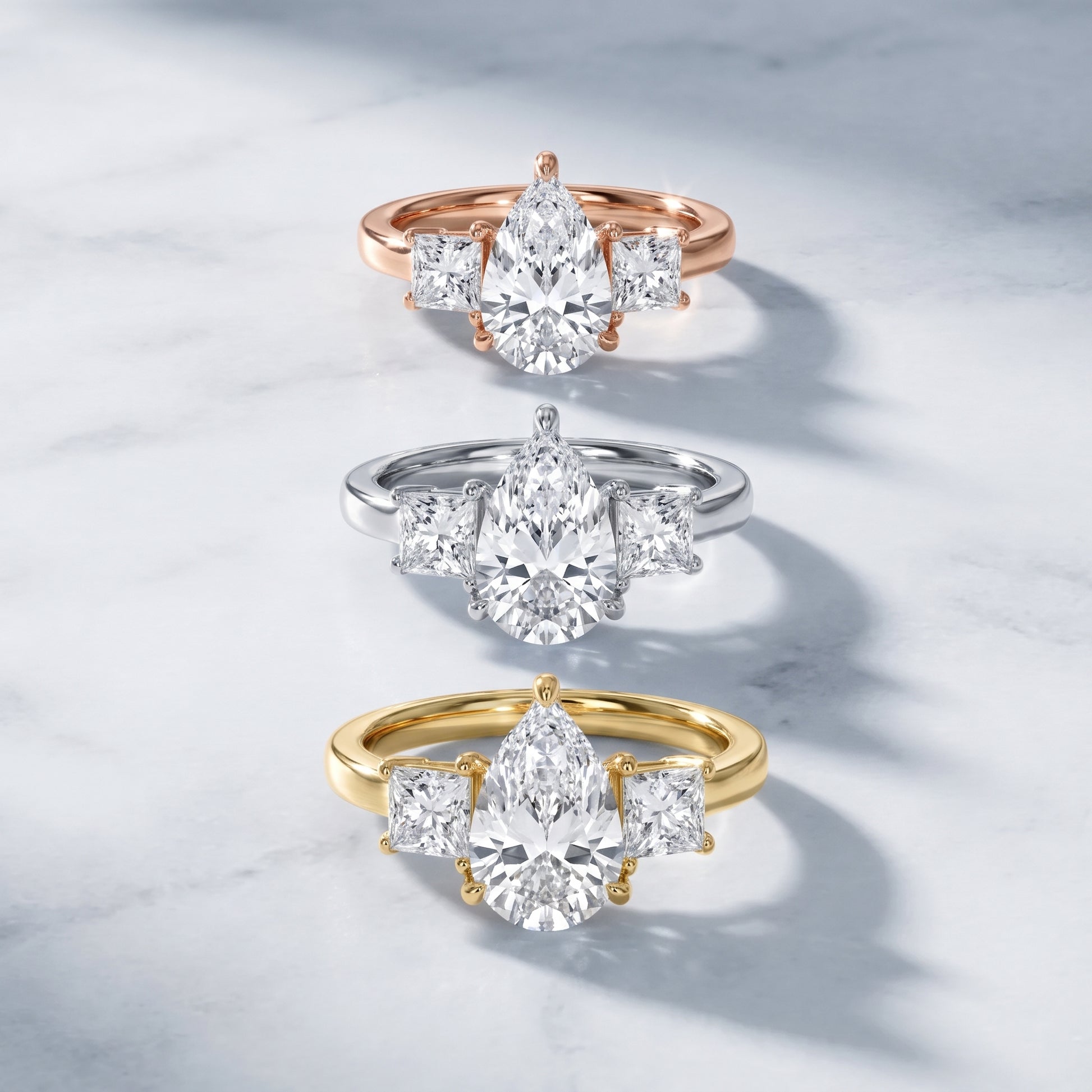Sienna Three-Stone Pear Diamond Ring in Yellow Gold - 3rings.jpg