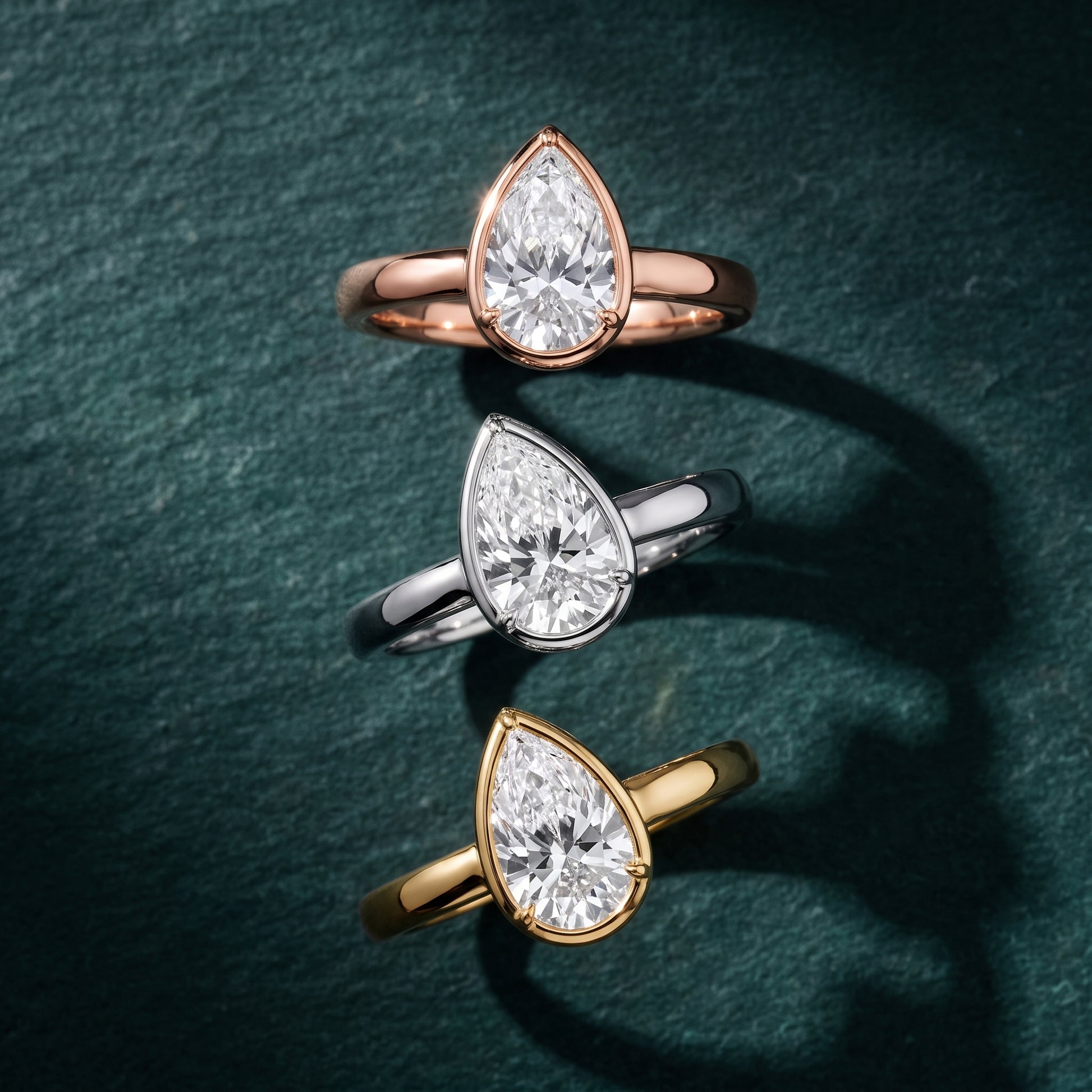 Alina Bezel Solitaire Pear Diamond Ring in White Gold - 3rings.jpg