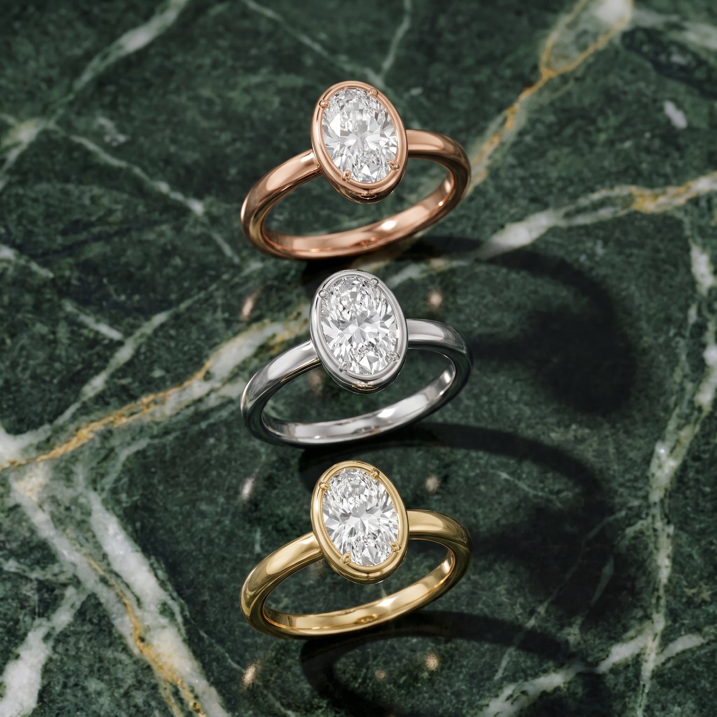 Alina Bezel Solitaire Oval Diamond Ring in Yellow Gold - 3rings.jpg