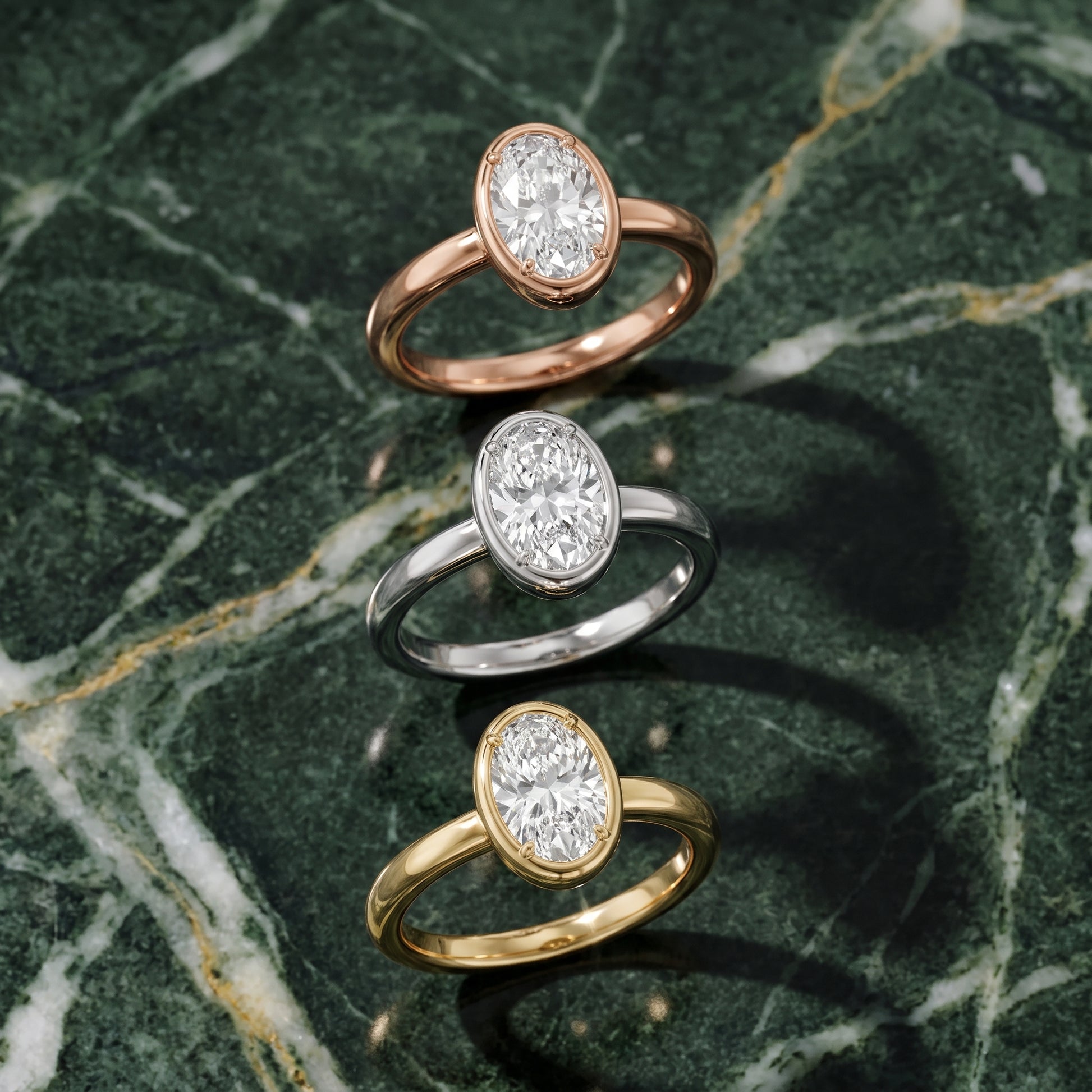 Alina Bezel Solitaire Oval Diamond Ring in Yellow Gold - 3rings.jpg