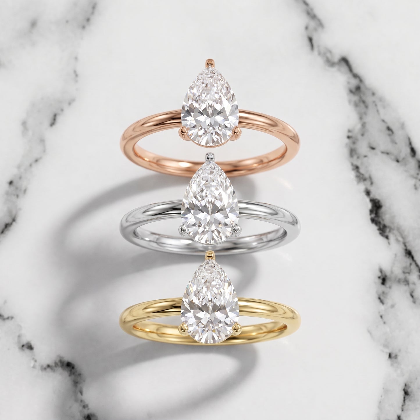Wren Solitaire Pear Diamond Ring in Rose Gold - 3rings.jpg