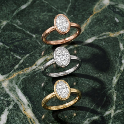 Alina Bezel Solitaire Oval Diamond Ring in White Gold - 3rings.jpg