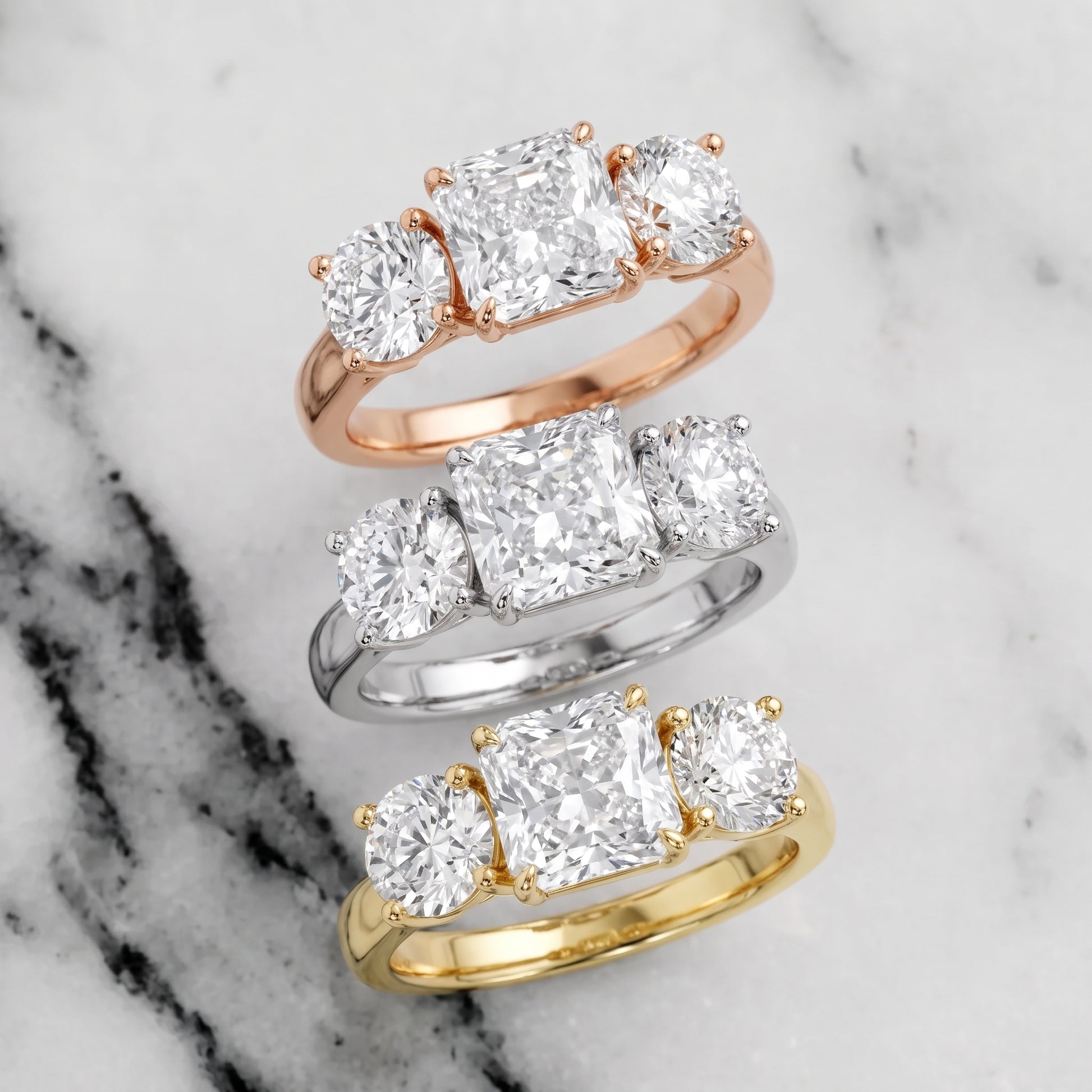Esme Three-Stone Tapered Radiant Diamond Ring in Platinum - 3rings.jpg