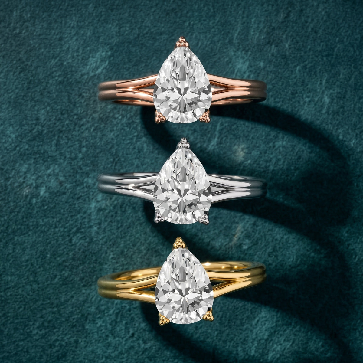 Neve Solitaire Split Shank Pear Diamond Engagement Ring in Silver - 3rings.jpg