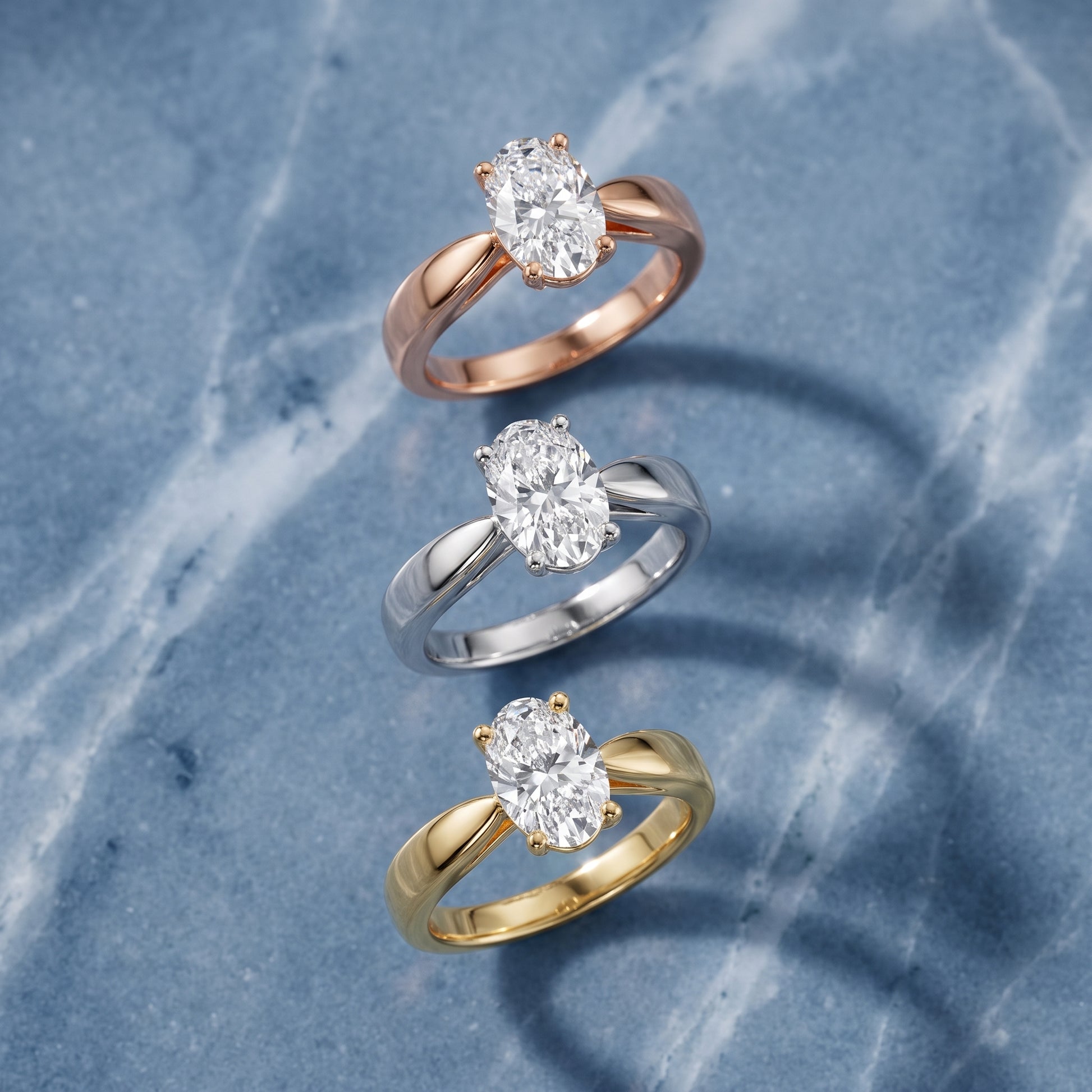 Talia Solitaire Twist Oval Diamond Engagement Ring in Rose Gold - 3rings.jpg