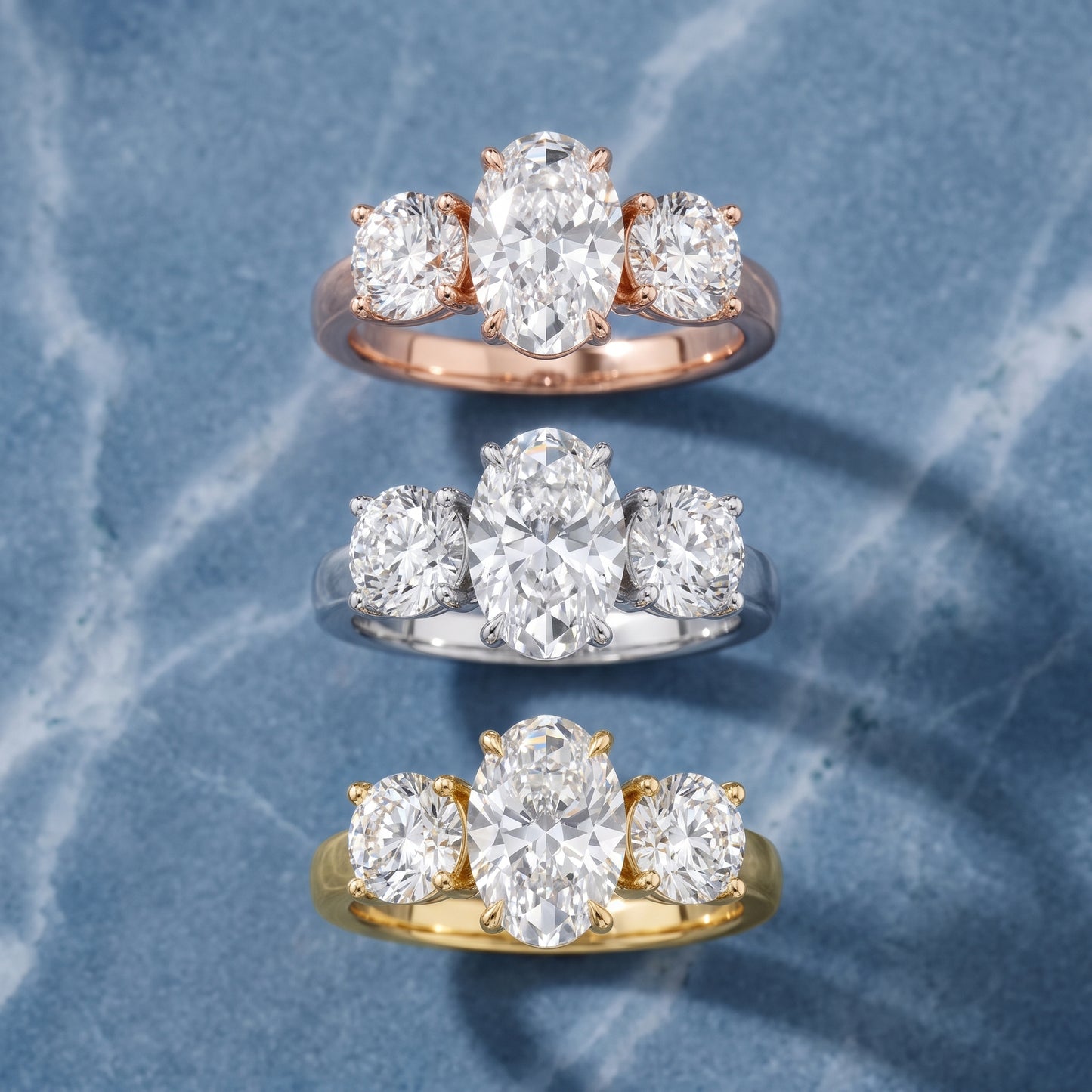 Esme Three-Stone Tapered Oval Diamond Ring in Platinum - 3rings.jpg