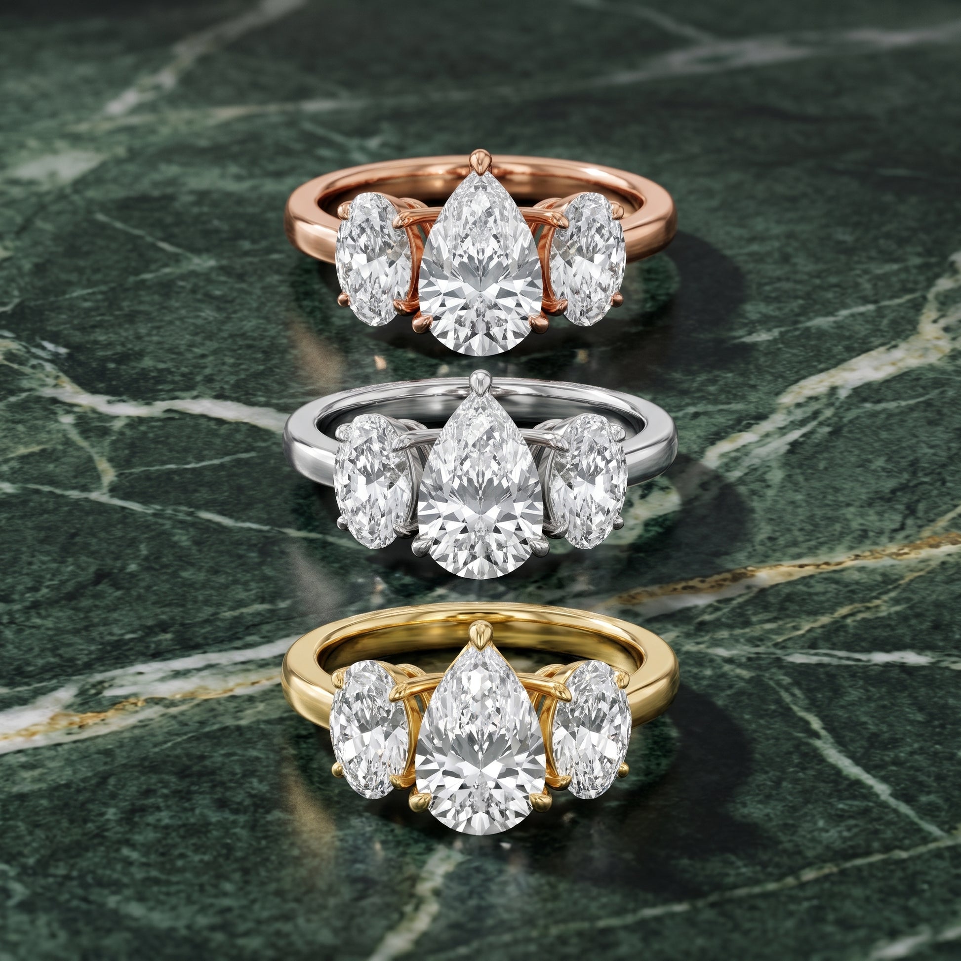 Lila Three-Stone Pear Diamond Ring in Yellow Gold - 3rings.jpg