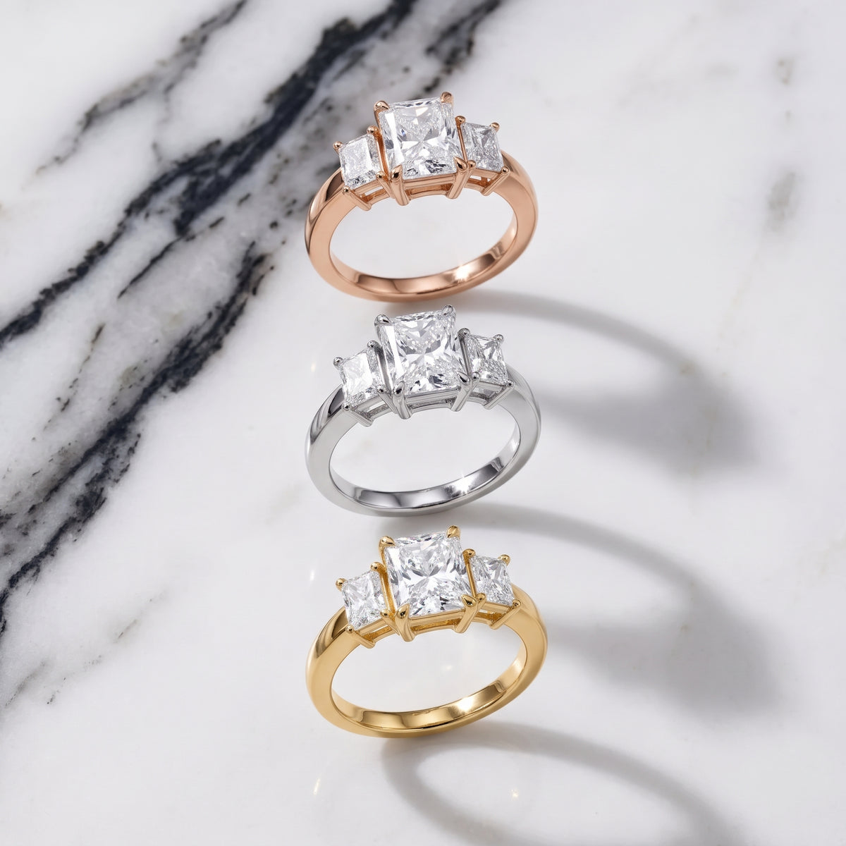 Zoe Three-Stone Radiant Diamond Engagement Ring in Yellow Gold - 3rings.jpg