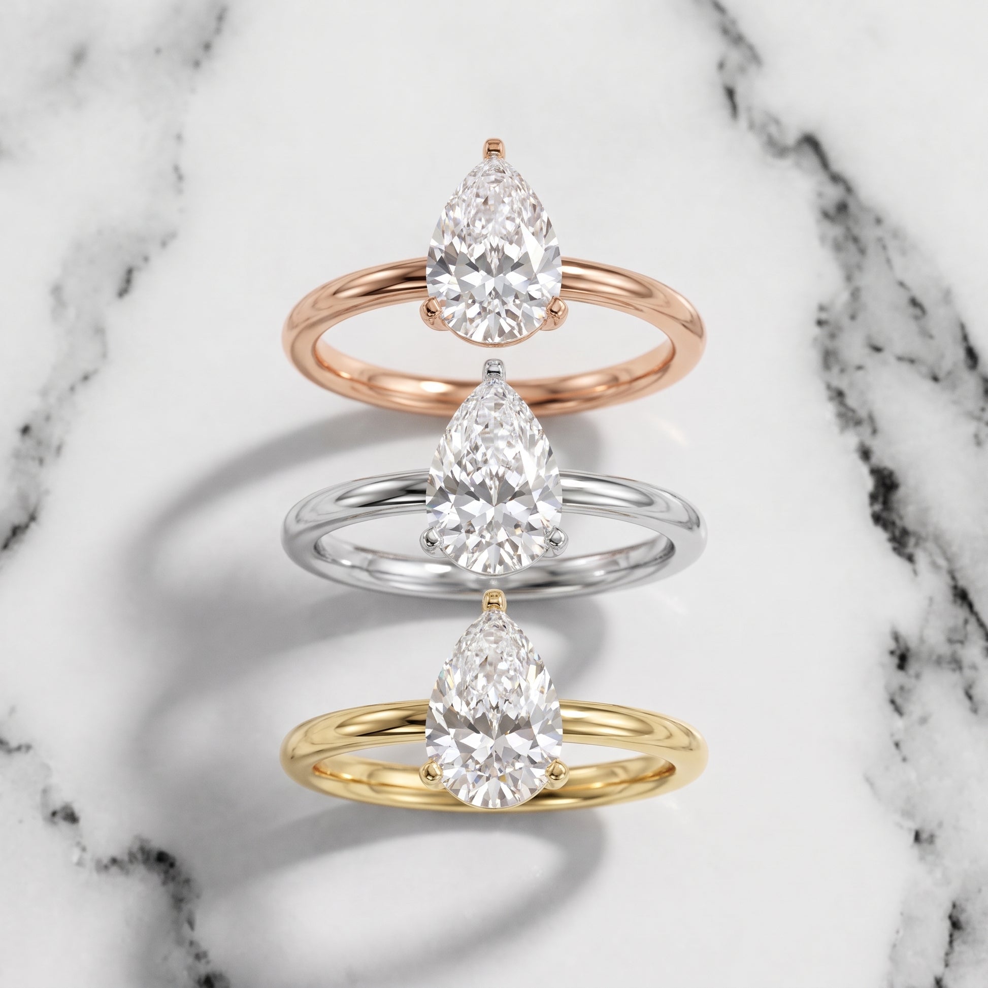 Wren Solitaire Pear Diamond Ring in Platinum - 3rings.jpg