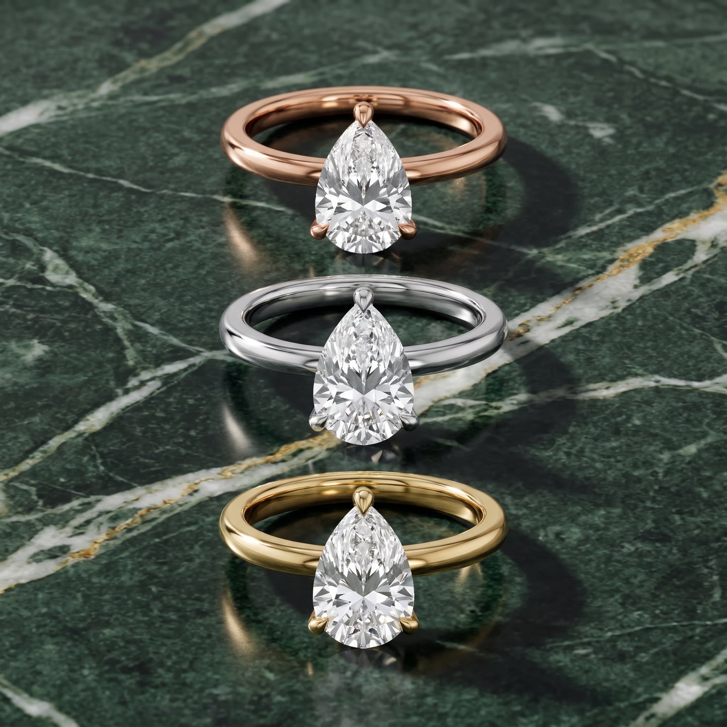 Nella Petite Solitaire Pear Diamond Engagement Ring in Yellow Gold - 3rings.jpg