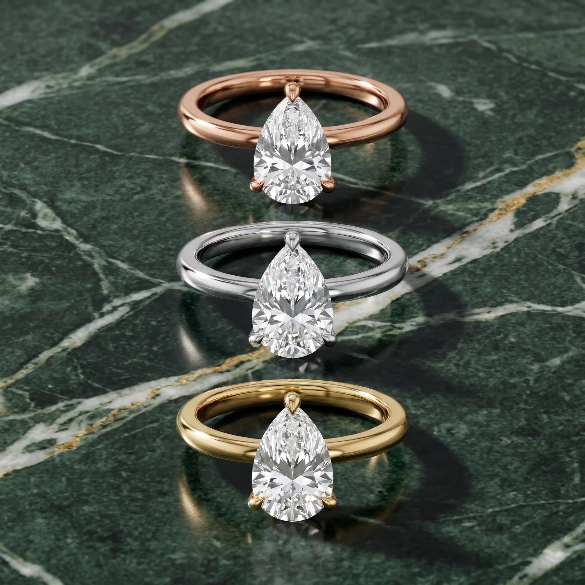 Nella Petite Solitaire Pear Diamond Engagement Ring in Platinum - 3rings.jpg