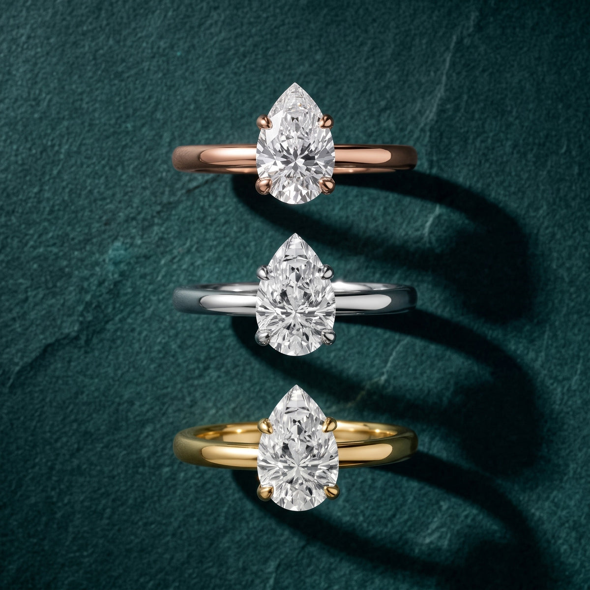 Charlotte Charm Solitaire Pear Diamond Engagement Ring in White Gold - 3rings.jpg