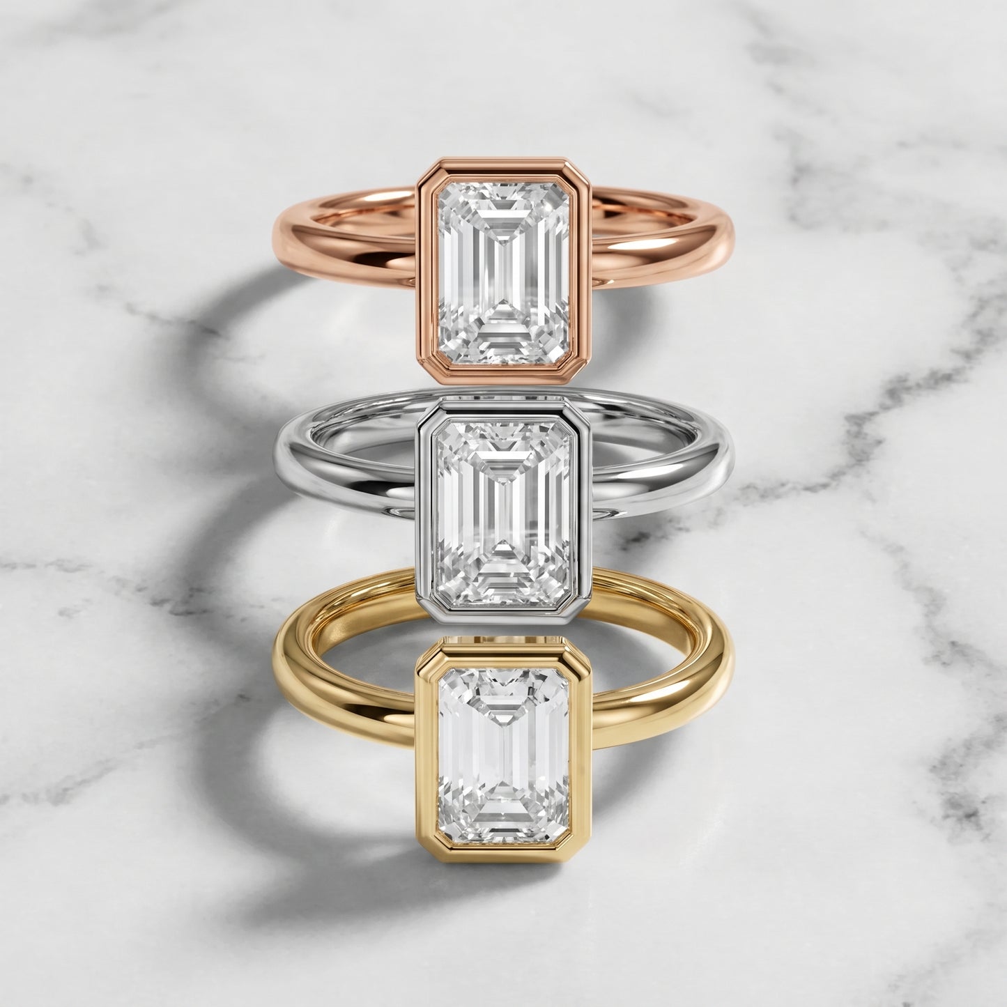Maeve Bezel Solitaire Emerald Diamond Ring in Yellow Gold - 3rings.jpg