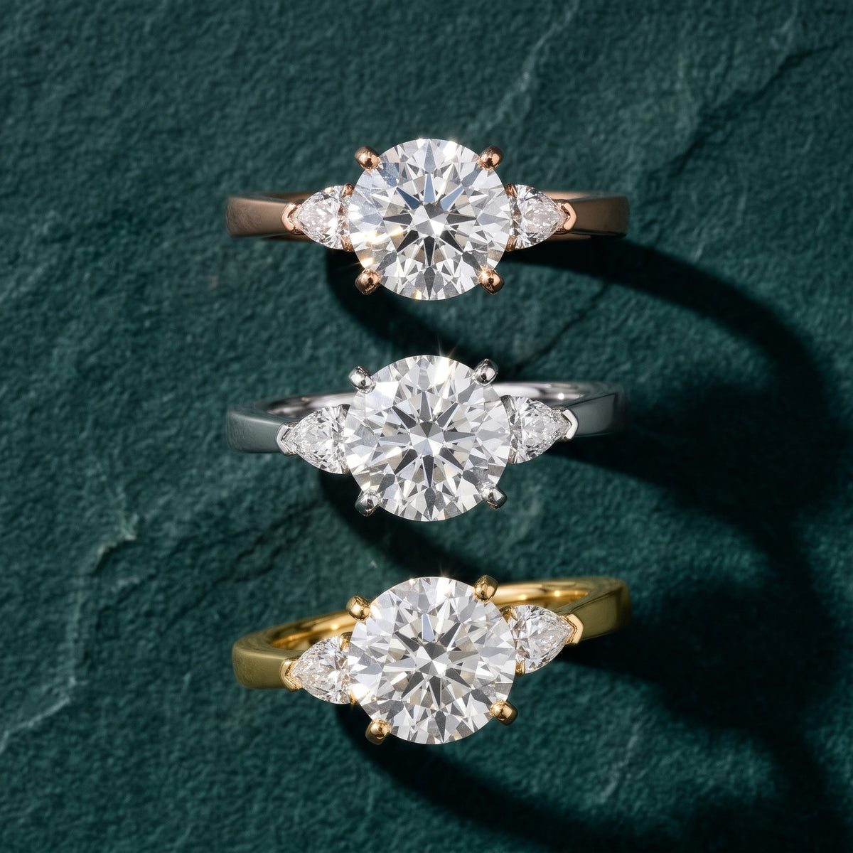 Amabel Three-Stone Round Diamond Engagement Ring in Platinum - 3rings.jpg