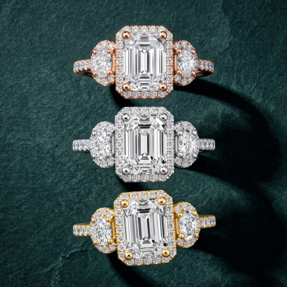 Austin Three-Stone Halo Emerald Diamond Engagement Ring in White Gold - 3rings.jpg