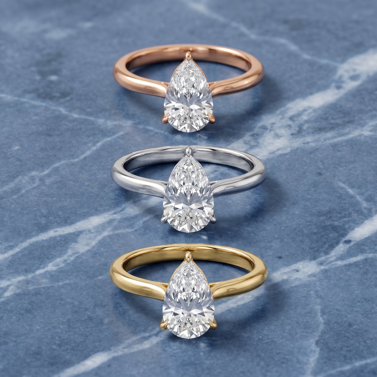 Evie Solitaire Six-Prong Pear Diamond Engagement Ring in Yellow Gold - 3rings.jpg