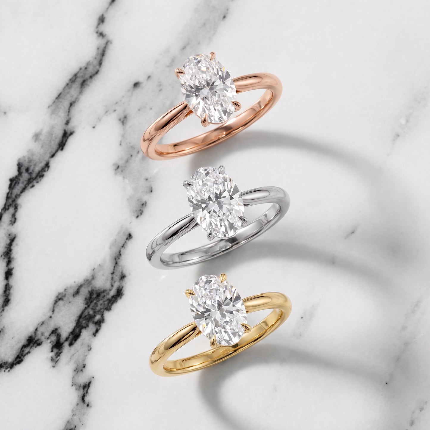 Evie Solitaire Six-Prong Oval Diamond Engagement Ring in Yellow Gold - 3rings.jpg