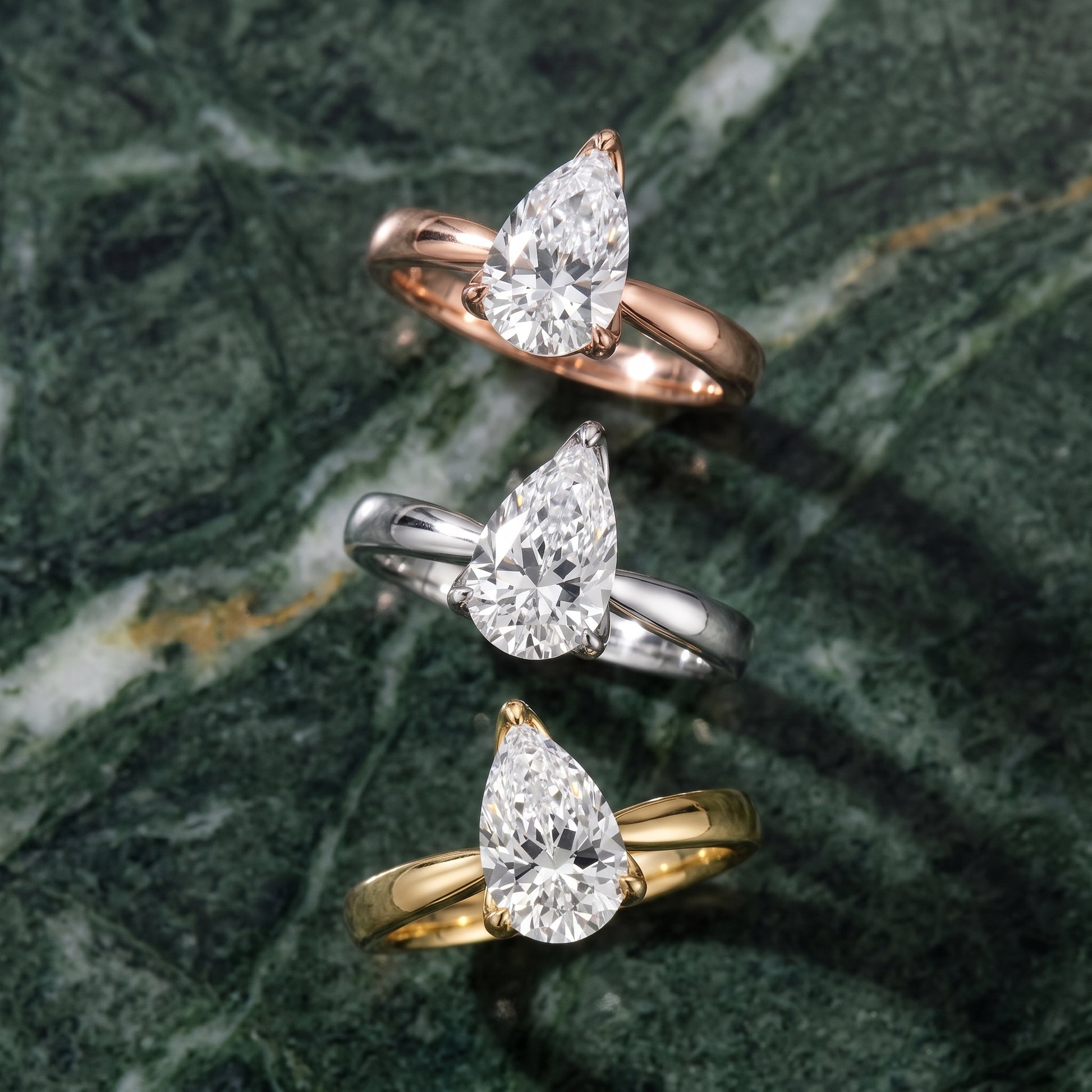 Lucia Solitaire Six-Prong Pear Diamond Engagement Ring in Platinum - 3rings.jpg