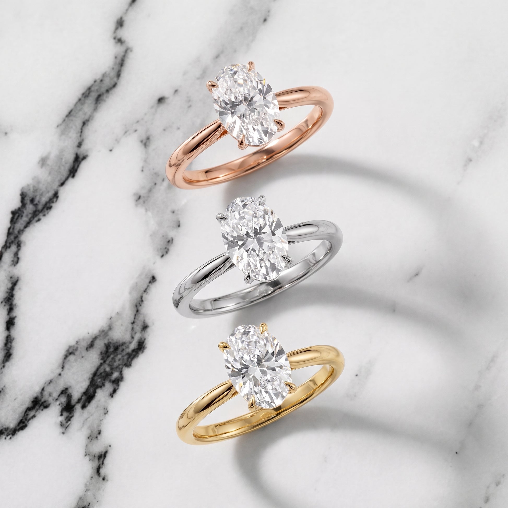 Evie Solitaire Six-Prong Oval Diamond Engagement Ring in Rose Gold - 3rings.jpg
