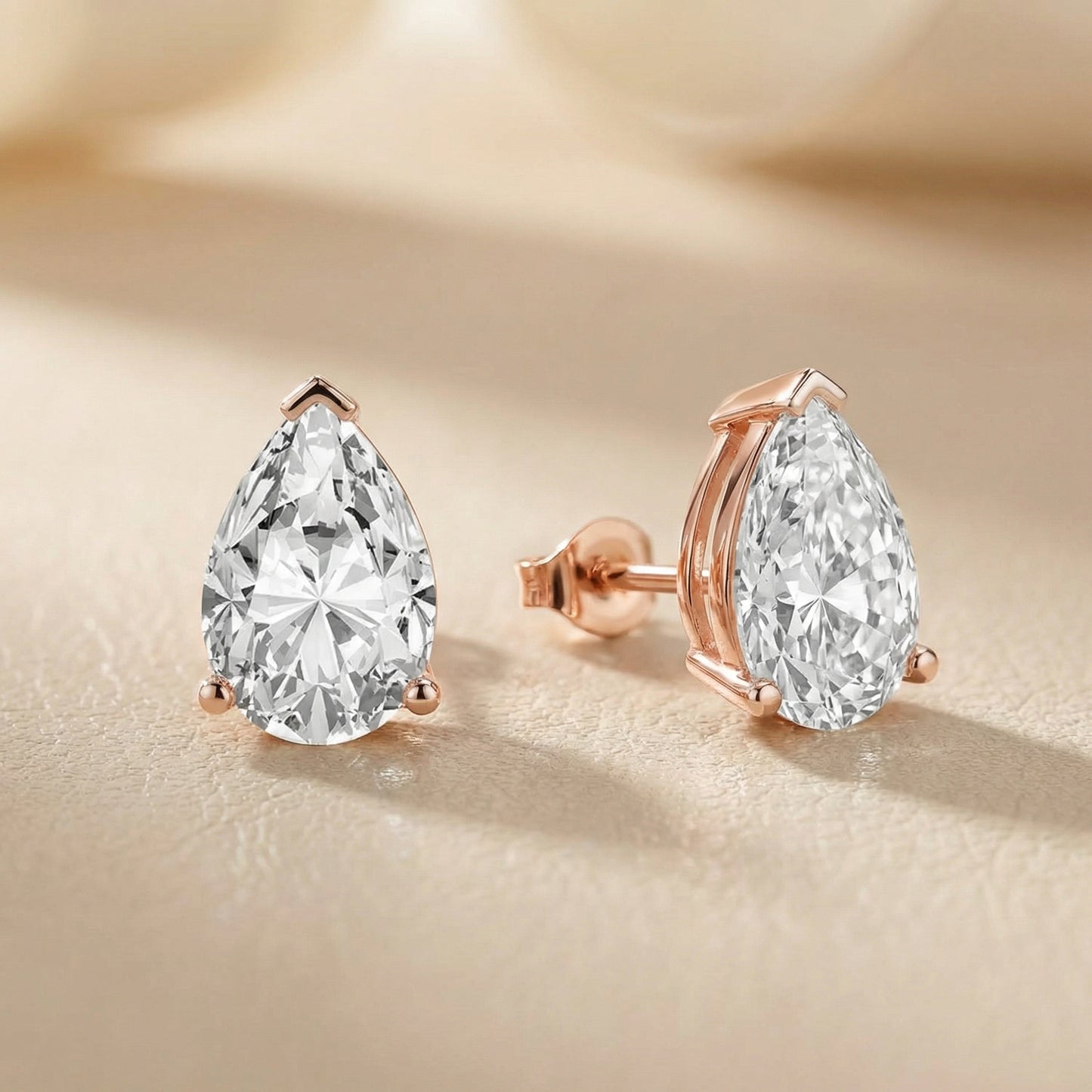 Three Prong Pear Diamond Stud Earrings in Rose Gold