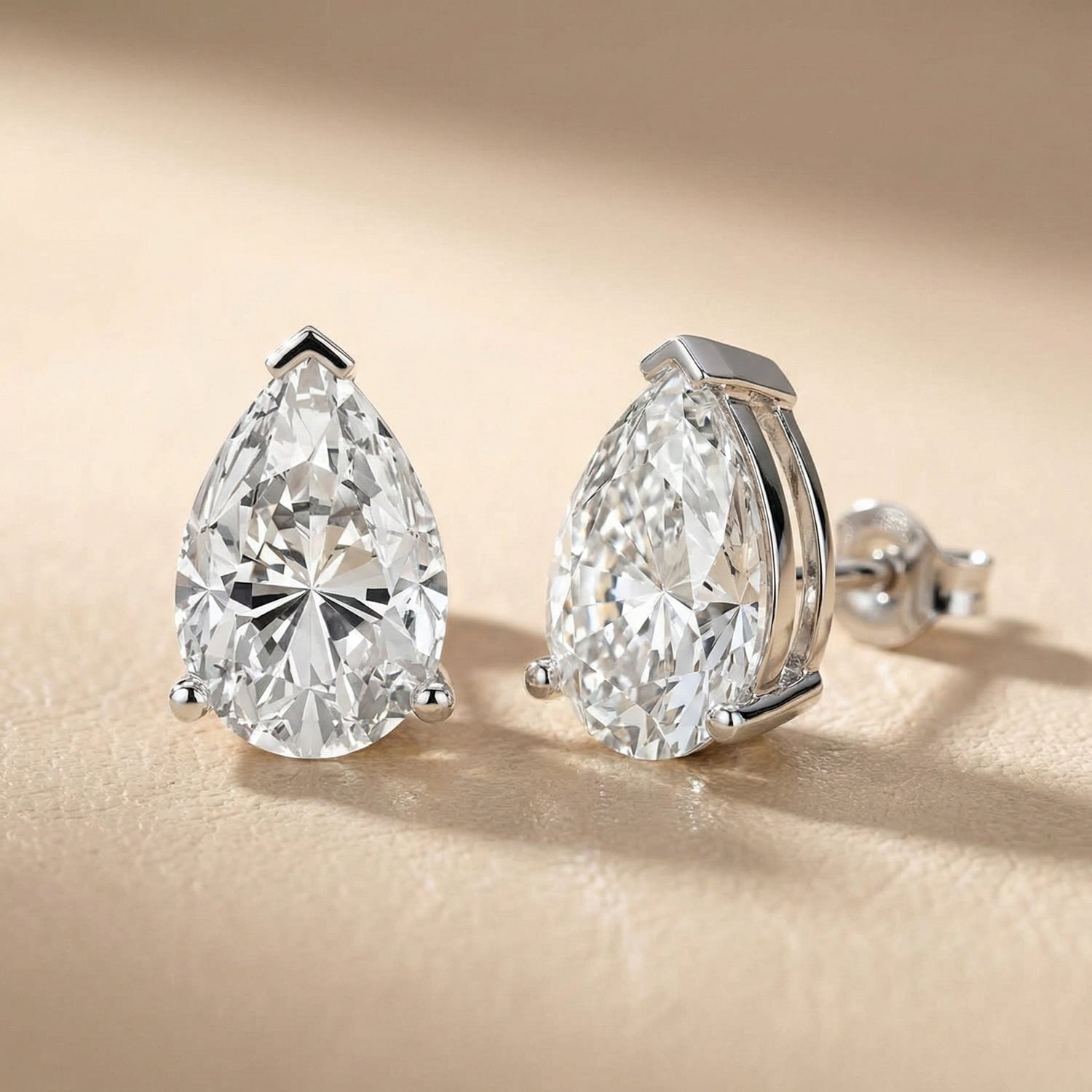 Three Prong Pear Diamond Stud Earrings in Silver