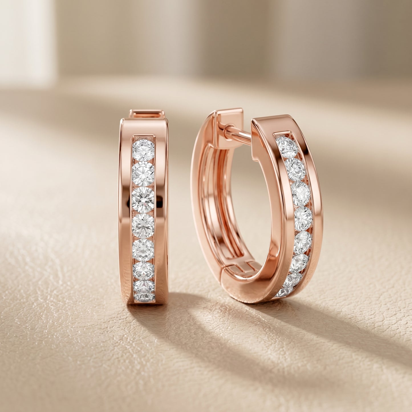 Round Cut Lab Grown Diamond Crest Channel Huggie Hoop Earrings in Rose Gold