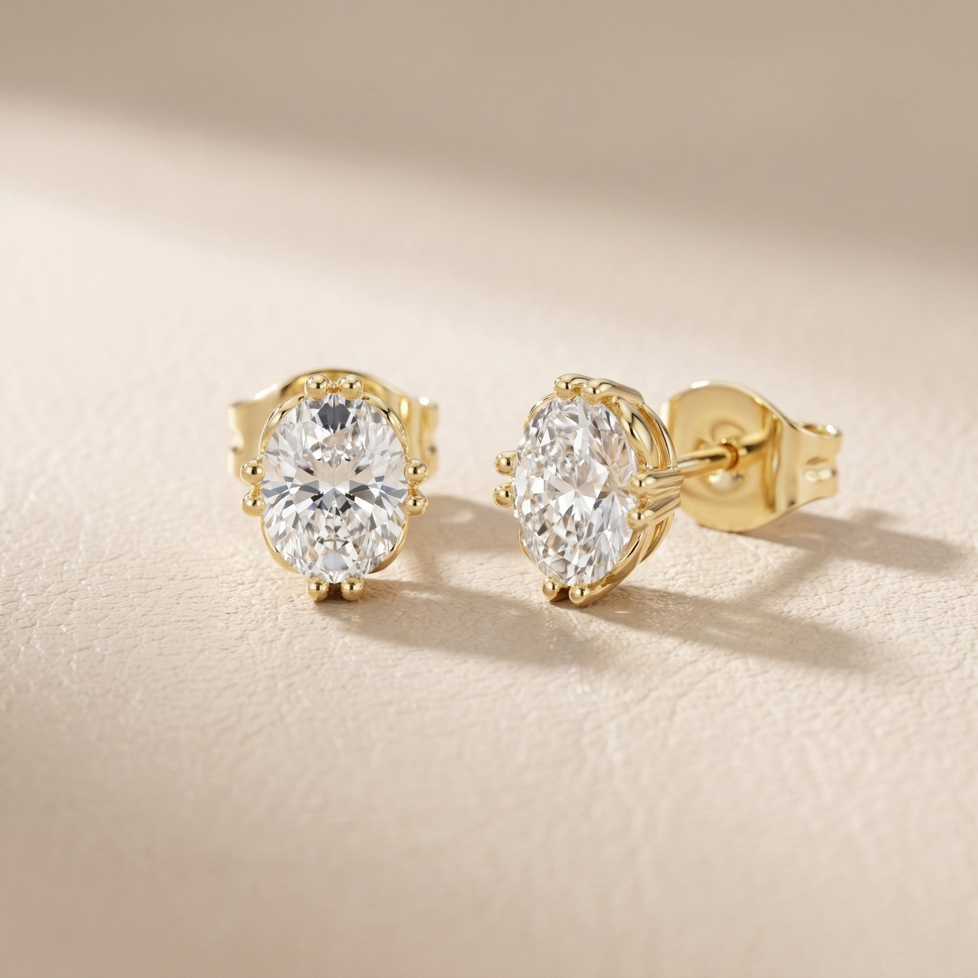 Oval Cut Lab Grown Diamond Stud Earrings in Yellow Gold