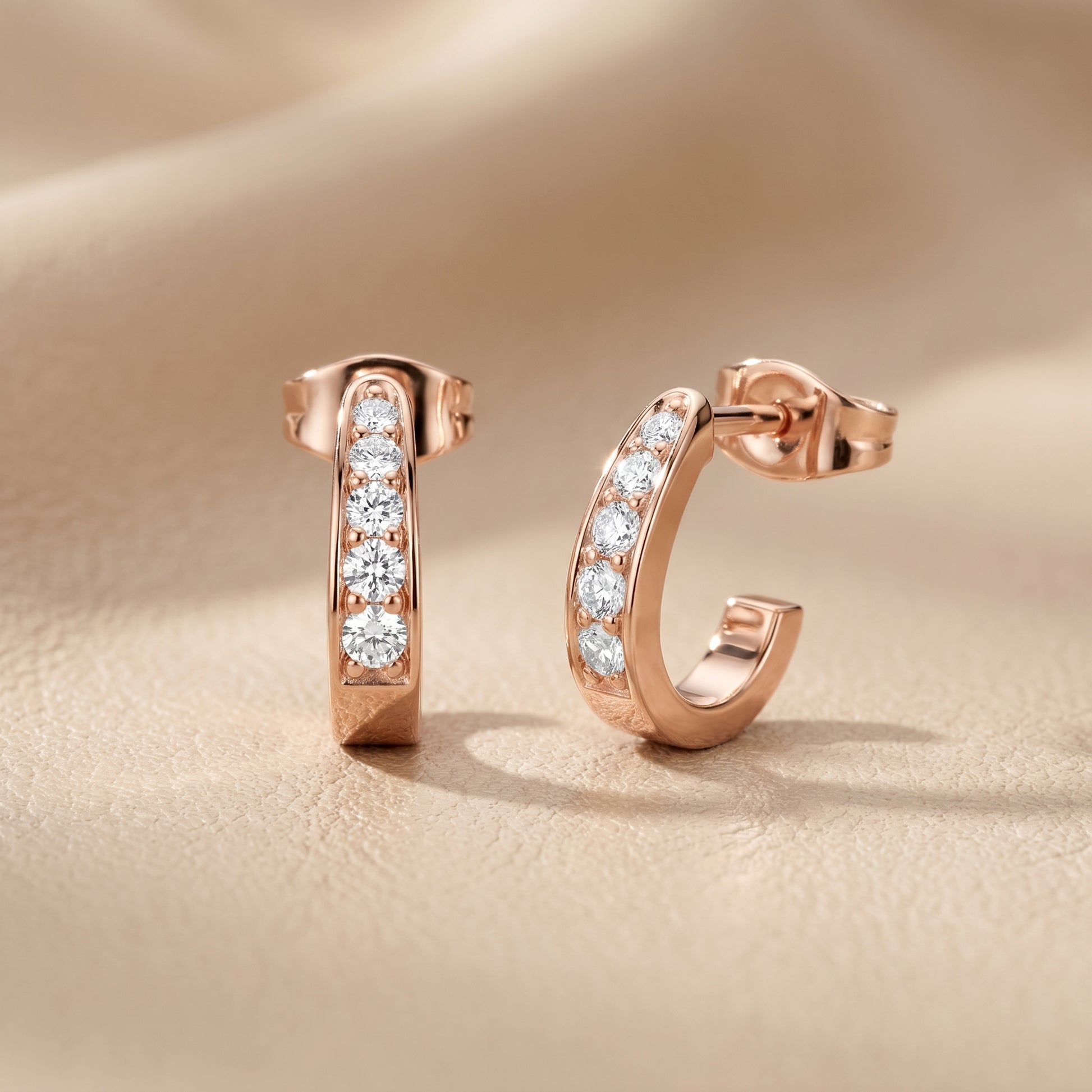 Round Cut Lab Grown Diamond Huggie Earrings in Rose Gold