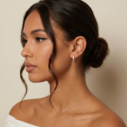 Round Cut Lab Grown Diamond Huggie Earrings in Rose Gold