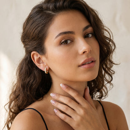 Round Cut Lab Grown Diamond Huggie Earrings in Yellow Gold