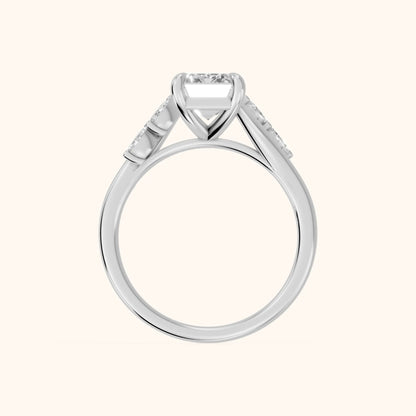 Flora Twist Side Stone Emerald Diamond Engagement Ring in Platinum - FingerView